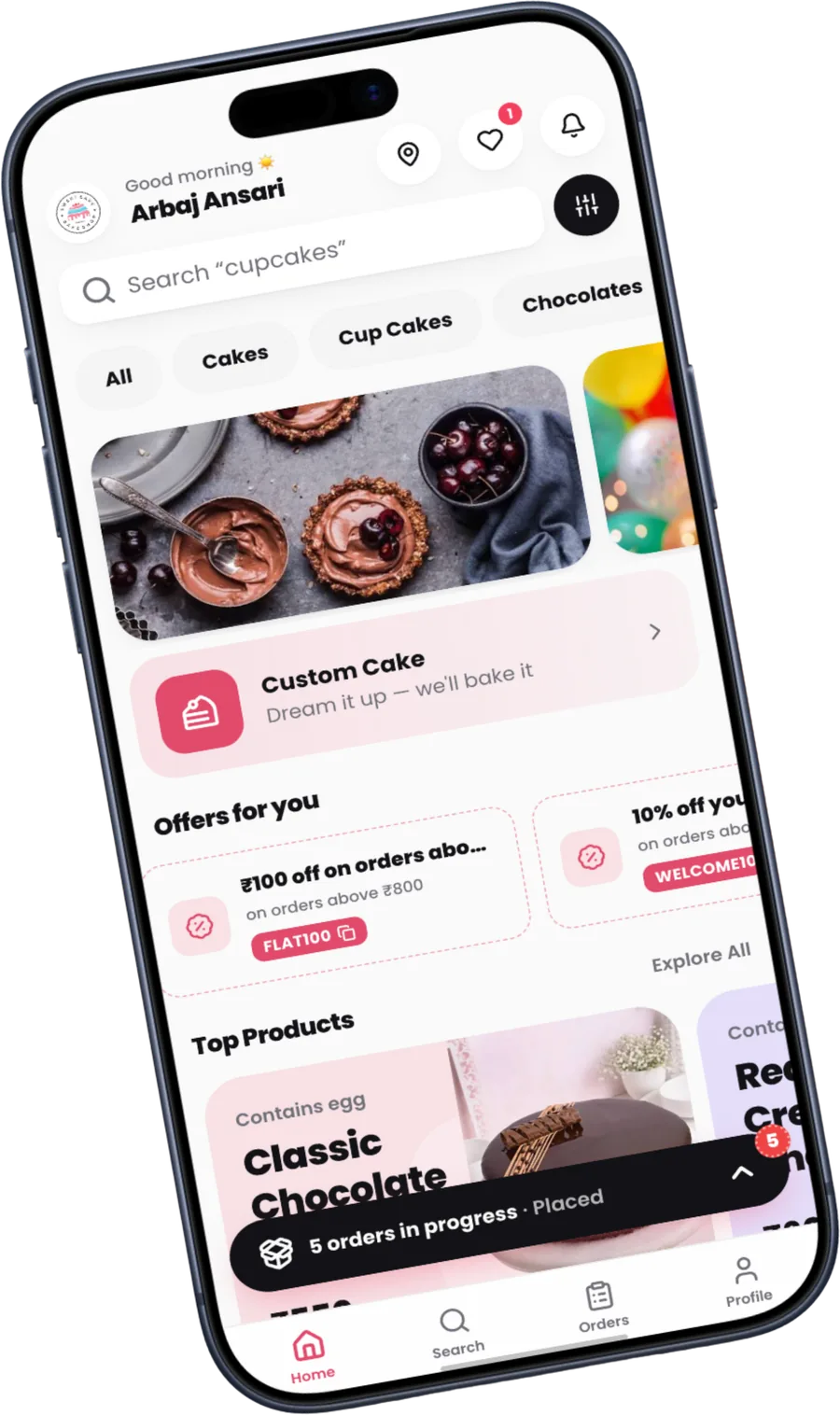 The Frostique storefront app on a phone, showing a bakery's own branded home screen with cakes, offers and a live order tracker